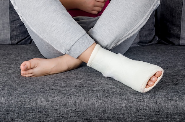 Young girl feet with bandage