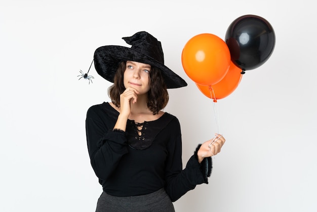 Young Girl in Halloween Costume over white wall