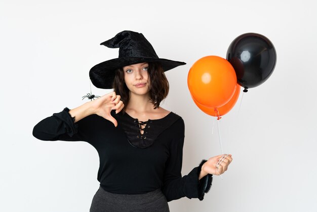 Young Girl in Halloween Costume over white wall