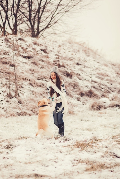 Young girl having fun with his dog