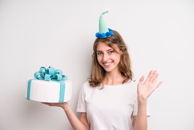 Young girl holding a birthday cake