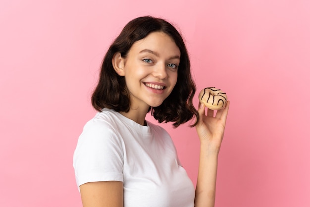 Young girl holding a donut