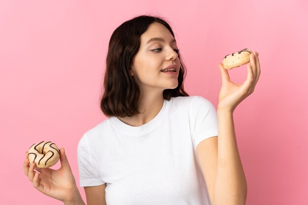 Young girl holding a donut