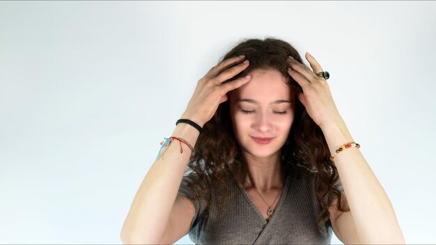 Young Girl Holding Her Head Cause Of Headache Photo