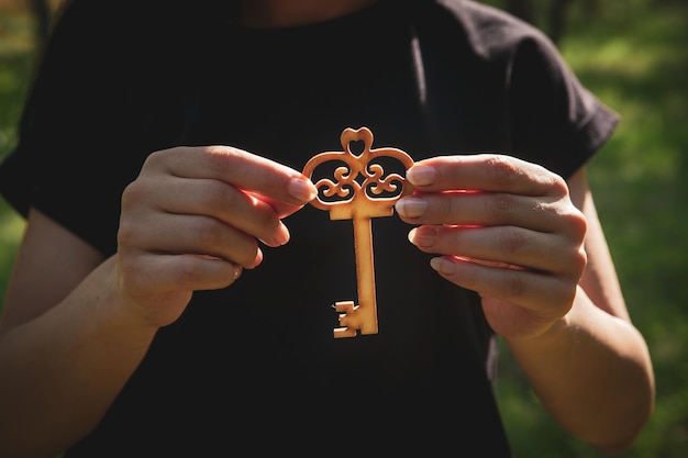 Young girl holding a key