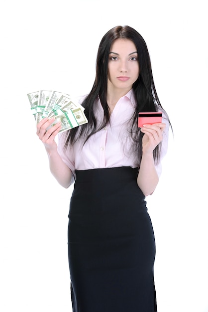 Young girl holds money and credit card.