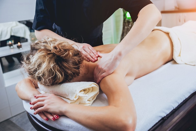 Young girl is relaxing in the spa.