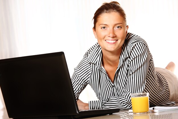 Young Girl is working on the laptop