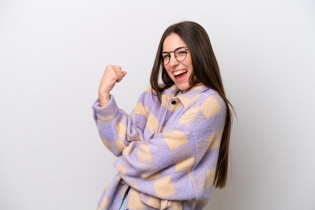 Photo young girl isolated on white background celebrating a victory