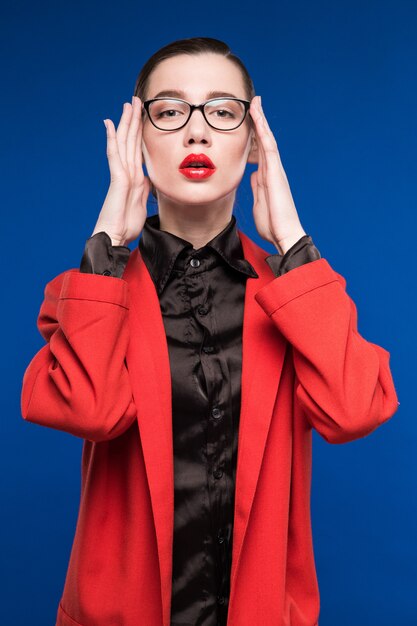 young girl in a jacket with red lips