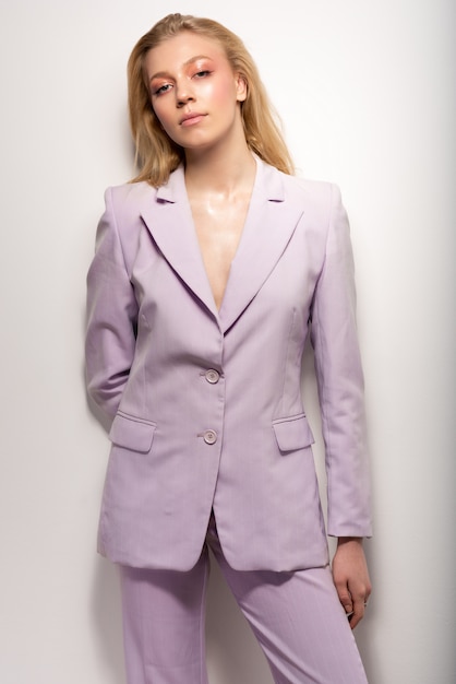 Young girl in a lilac business suit