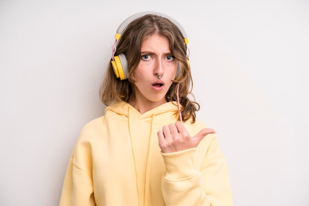 Young girl listening music with her headphones