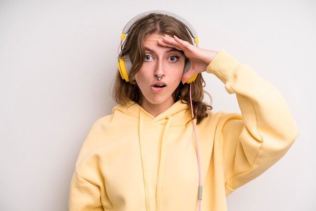 Young girl listening music with her headphones