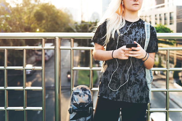 A young girl listening to the music