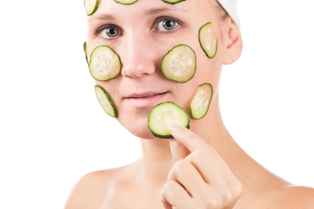 A young girl makes a face mask