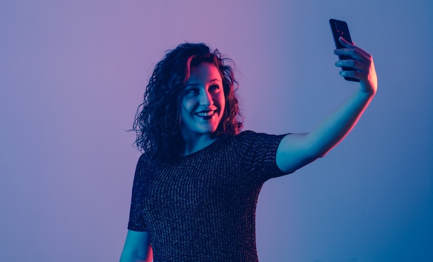 Young girl making selfie and smiling