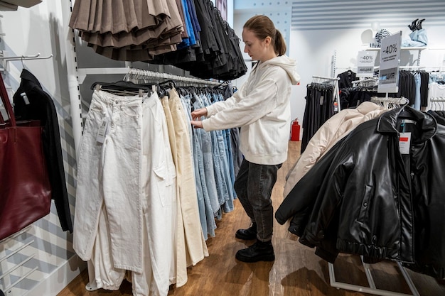 A young girl at the mall picking out her clothes Russia Moscow November 18 2023