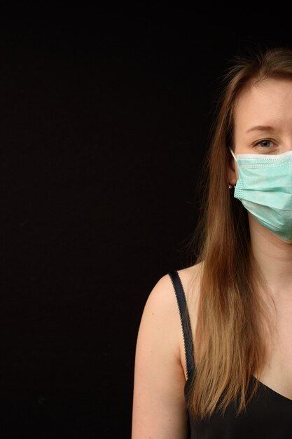 Young girl in a medical mask.