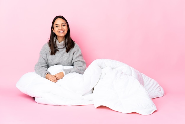 Young girl in pajamas over isolated background