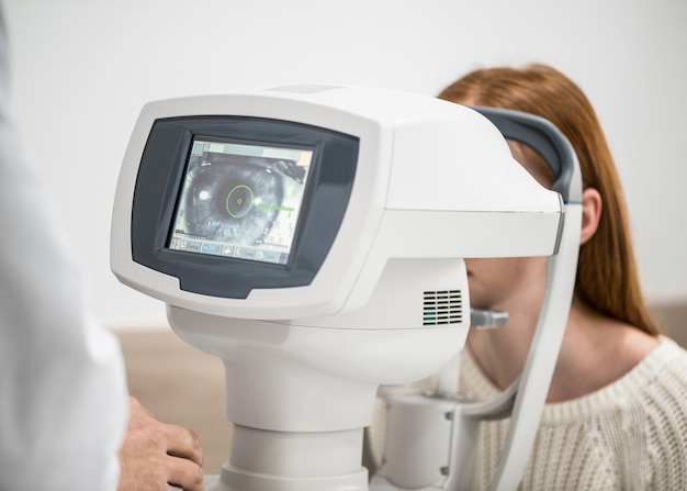 Young girl patient on reception at doctor ophthalmologist Diagnostic ophthalmologic equipment