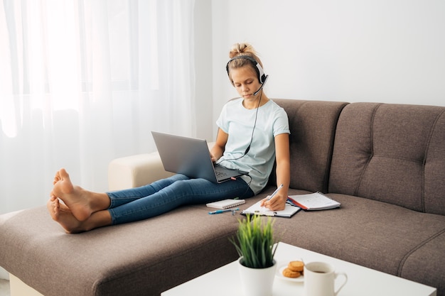 Young girl paying attention to online class