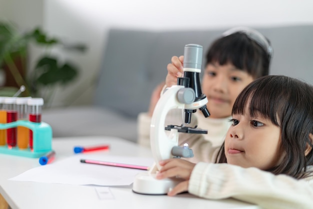 Young girl play science experiments for homeschooling