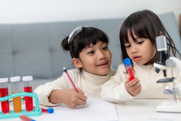 Young girl play science experiments for homeschooling