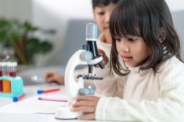 Young girl play science experiments for homeschooling