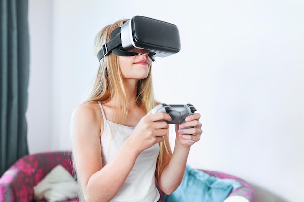 Young girl playing VR game at home