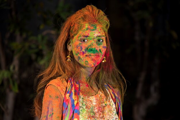 A young girl plays with colors