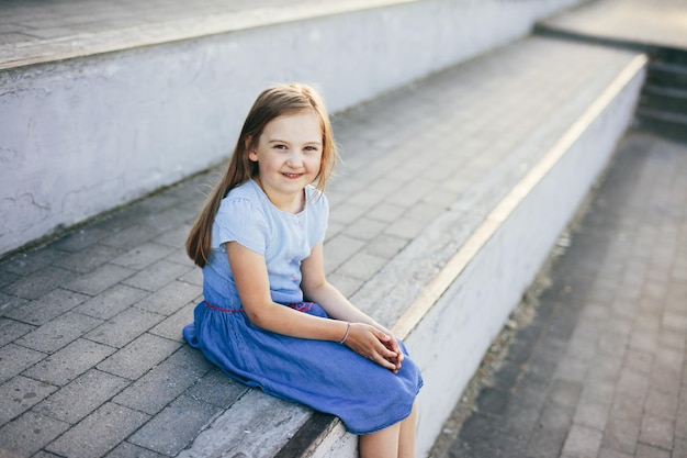 Young girl portrait outdoor in urban neighborhood at summer