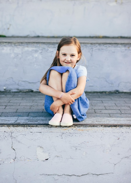 Young girl portrait outdoor in urban neighborhood at summer