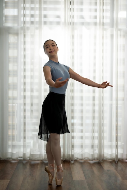 Young girl practicing ballet dancing Young ballerina practicing classic choreography