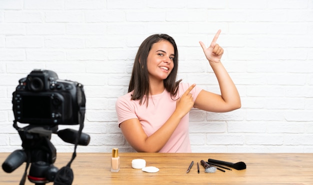 Young girl recording a video tutorial pointing with the index finger a great idea