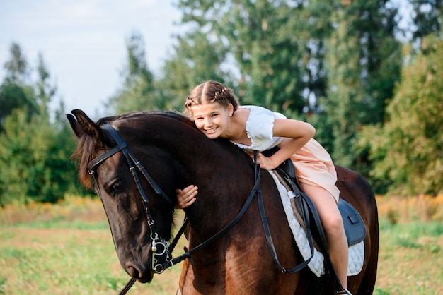 Young girl riding a horse