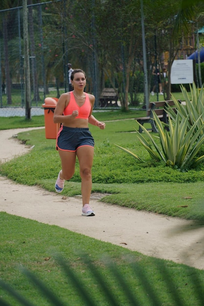 Young girl running in the park. 