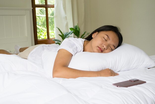 Young girl sleeping on bedroomclean room minimal room