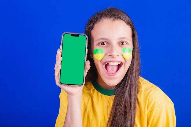 Young girl soccer fan from Brazil holding cellphone screen for advertisement promotion Smartphone applications