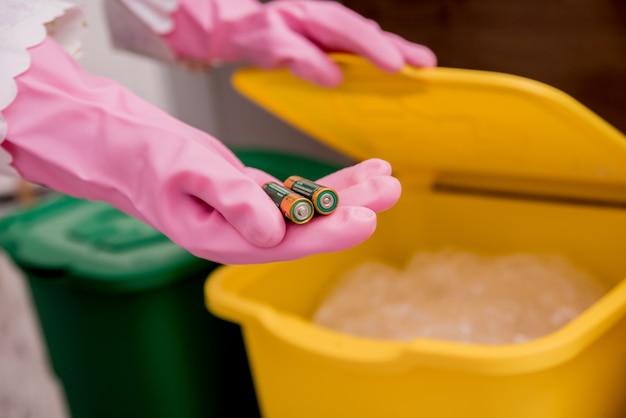 Young girl sorting garbage at the kitchen. concept of\
recycling. zero waste