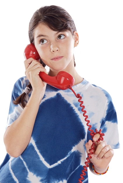 Young girl speaking on the telephone a over white background