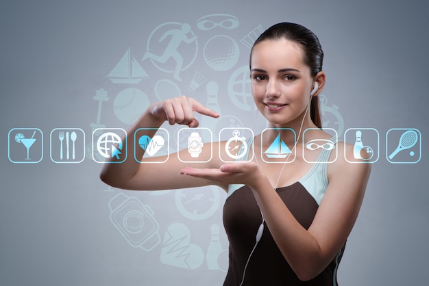 Young girl in sports concept pressing virtual buttons