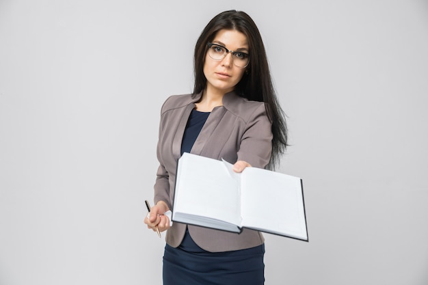 Young girl stretches out ahead the day planner isolated on light 