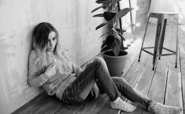 A young girl student rests in a cozy roomxA