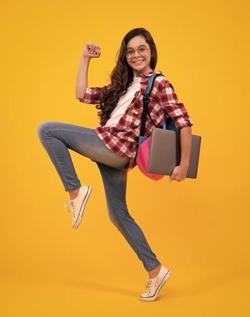 Young girl student studying hold computer elearning concept funny pupil with laptop back to school