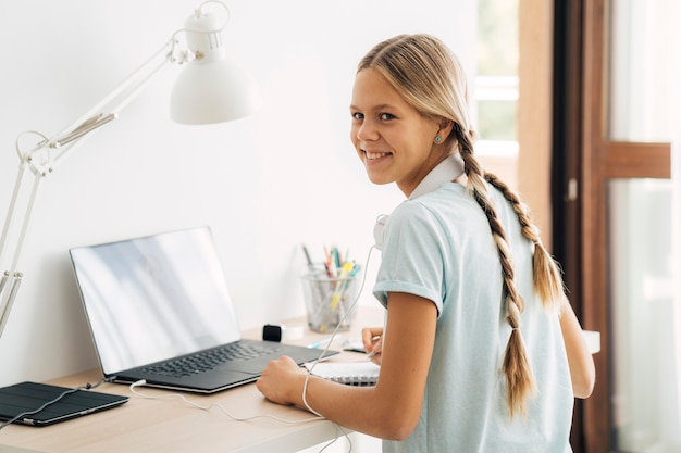 Young girl studying at home