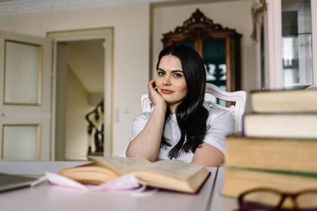 Young girl studying in living room at home