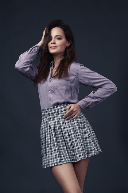 Young   girl in style shirt and pink shirt