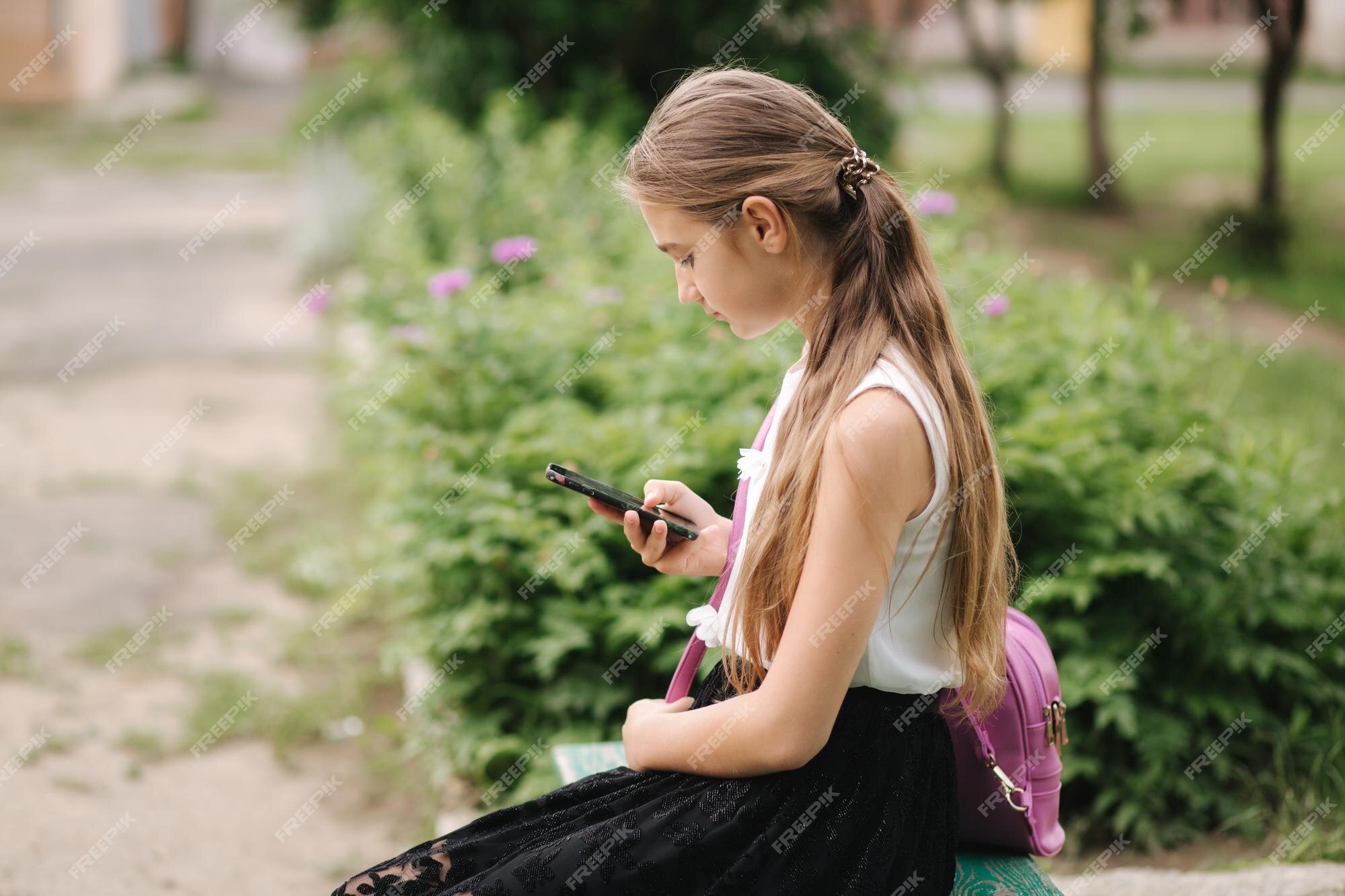 Young Girl Use Phone during School Break. Girl Play Online Games Stock  Image - Image of cute, game: 151348601