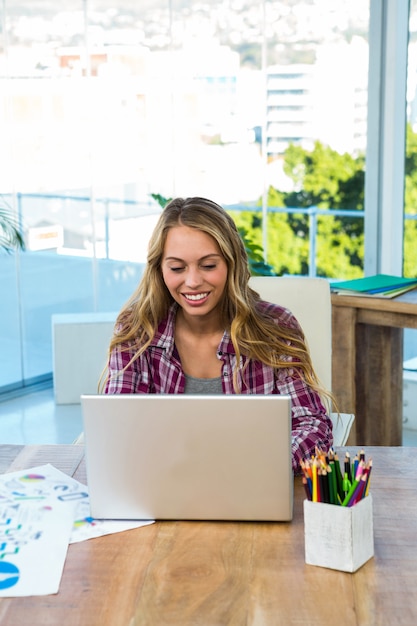 Young girl uses his computer in an office