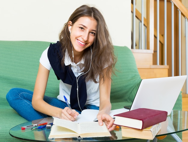 young girl using laptop at home 